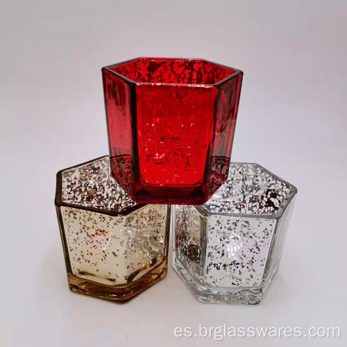 Portavelas de cristal en forma hexagonal con diferentes colores